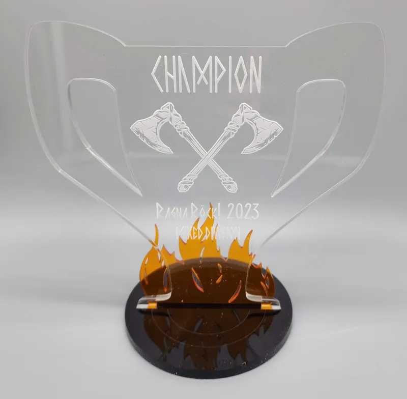 RagnaRock Champion Trophy — engraved acrylic with flame base